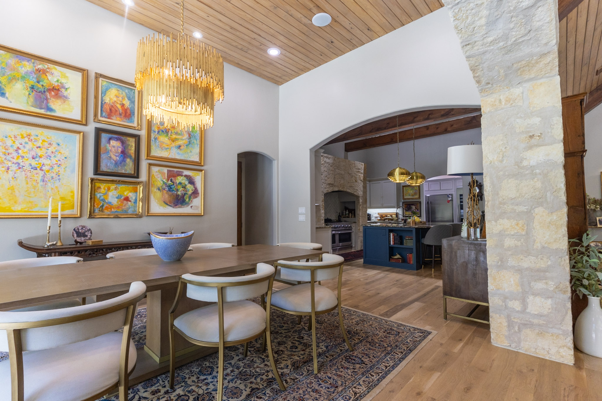 Dining Room with Custom Stone Arch and Wood Ceiling