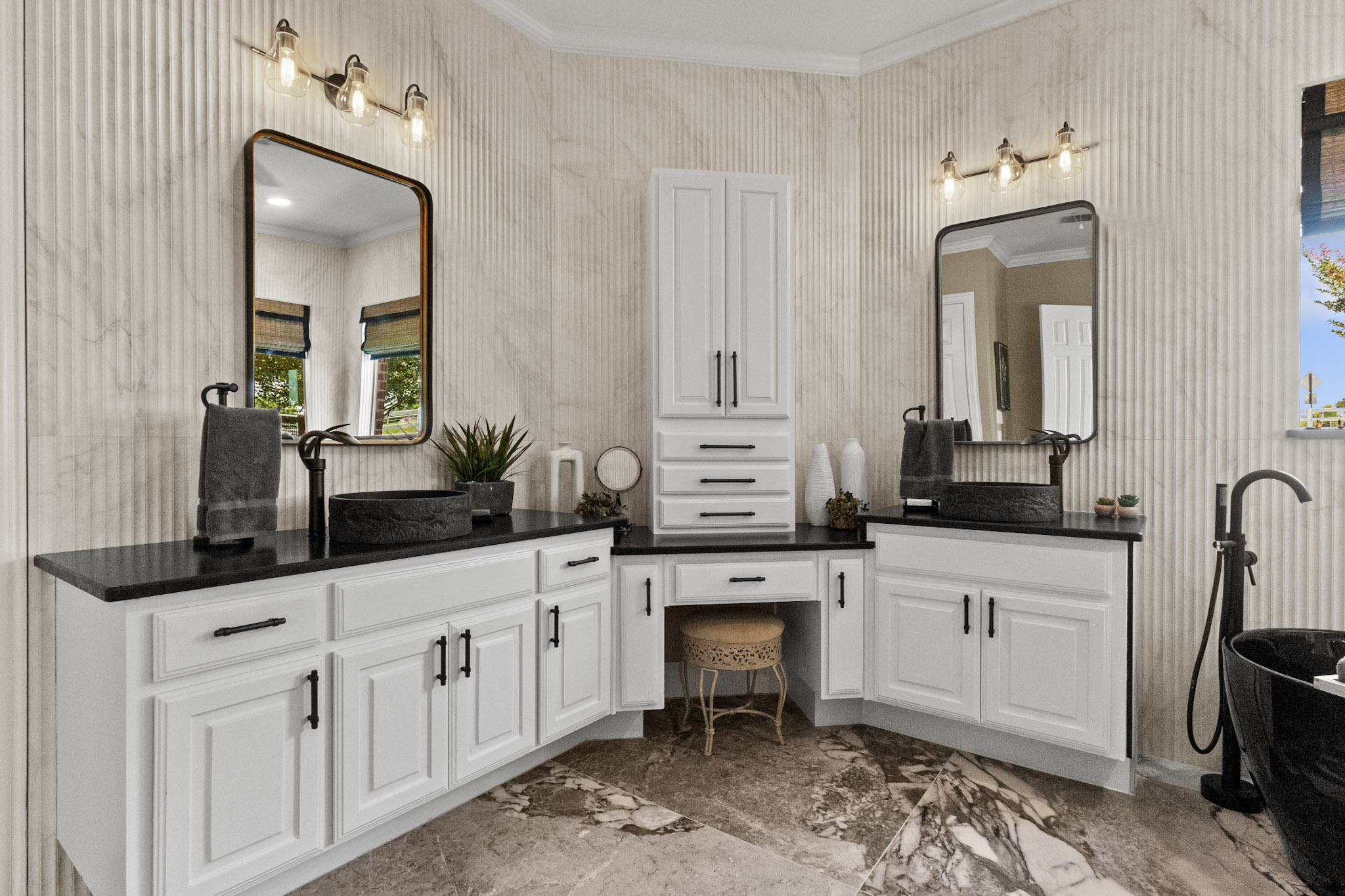 Primary bathroom remodel with dual vanities and black fixtures in Celina, Texas