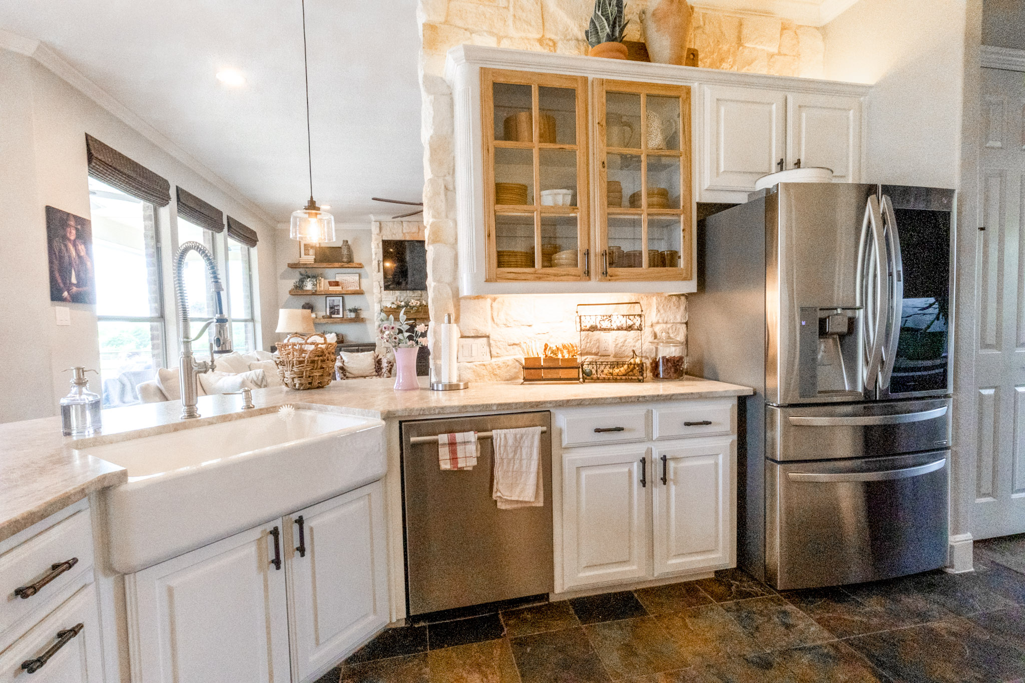 Remodeled kitchen with farmhouse sink and custom cabinetry in Celina, Texas