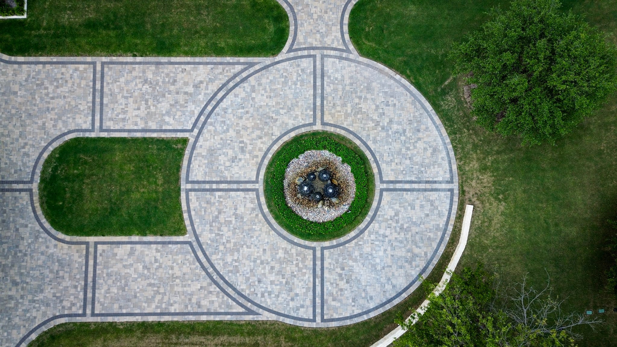 Allen drone photography showing a large circular paver motor court and custom home.