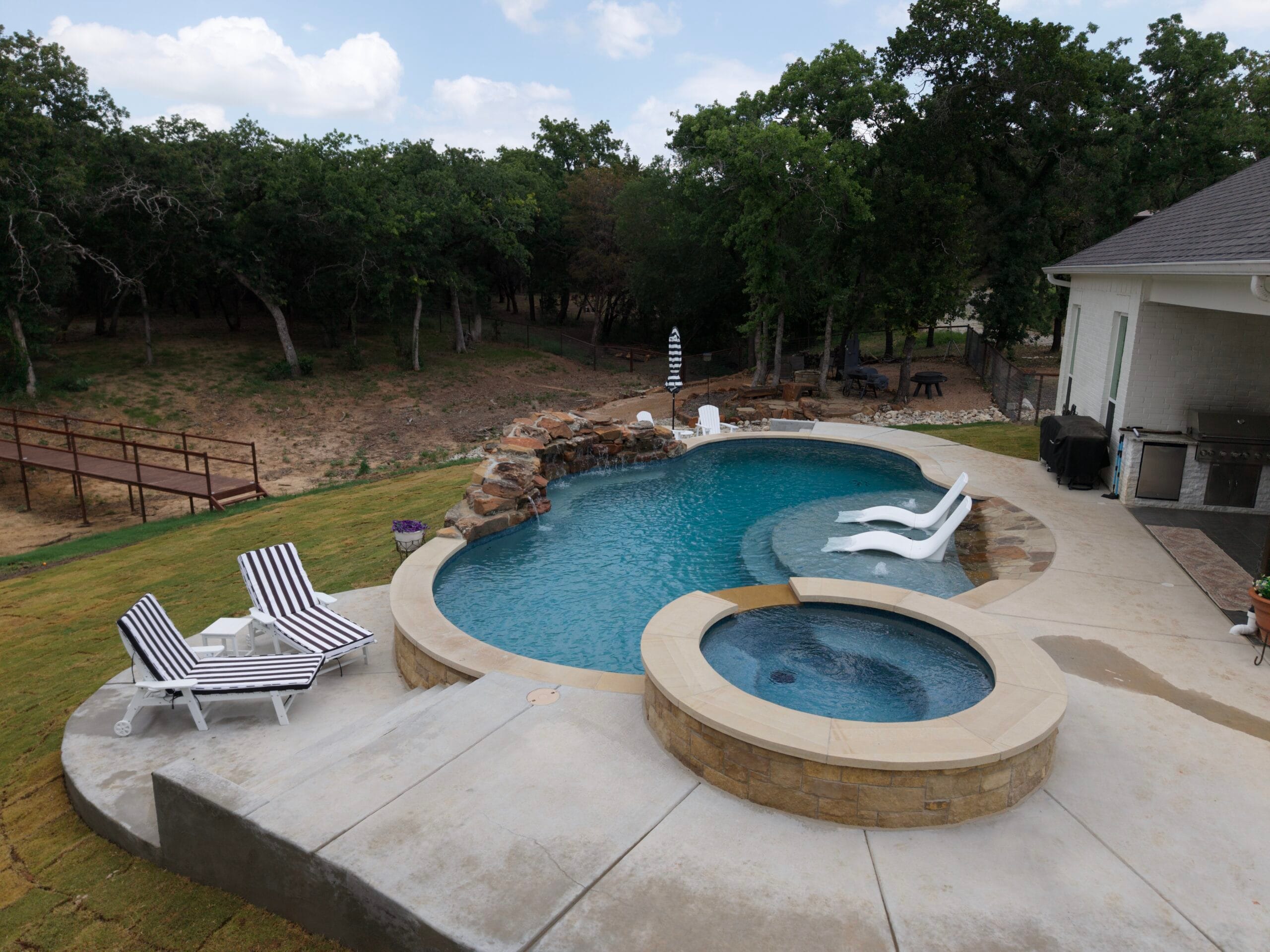 Aerial photography of a Five Alarm Pools pool and spa project in Weatherford, Texas.