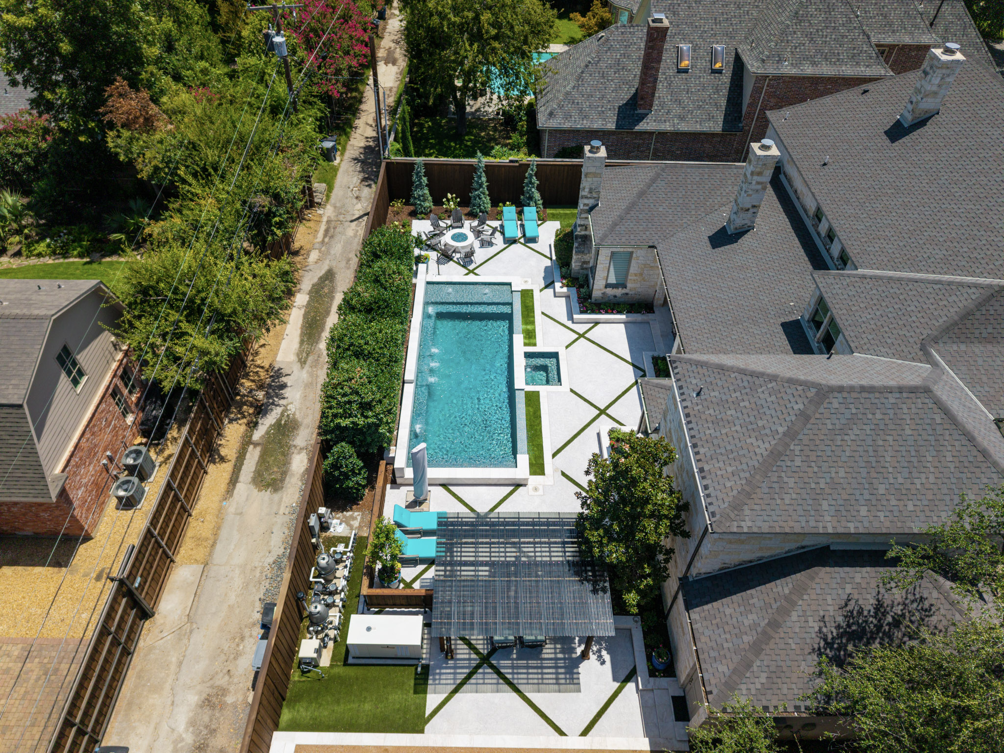 Aerial view of custom pool and outdoor living space in University Park, Texas