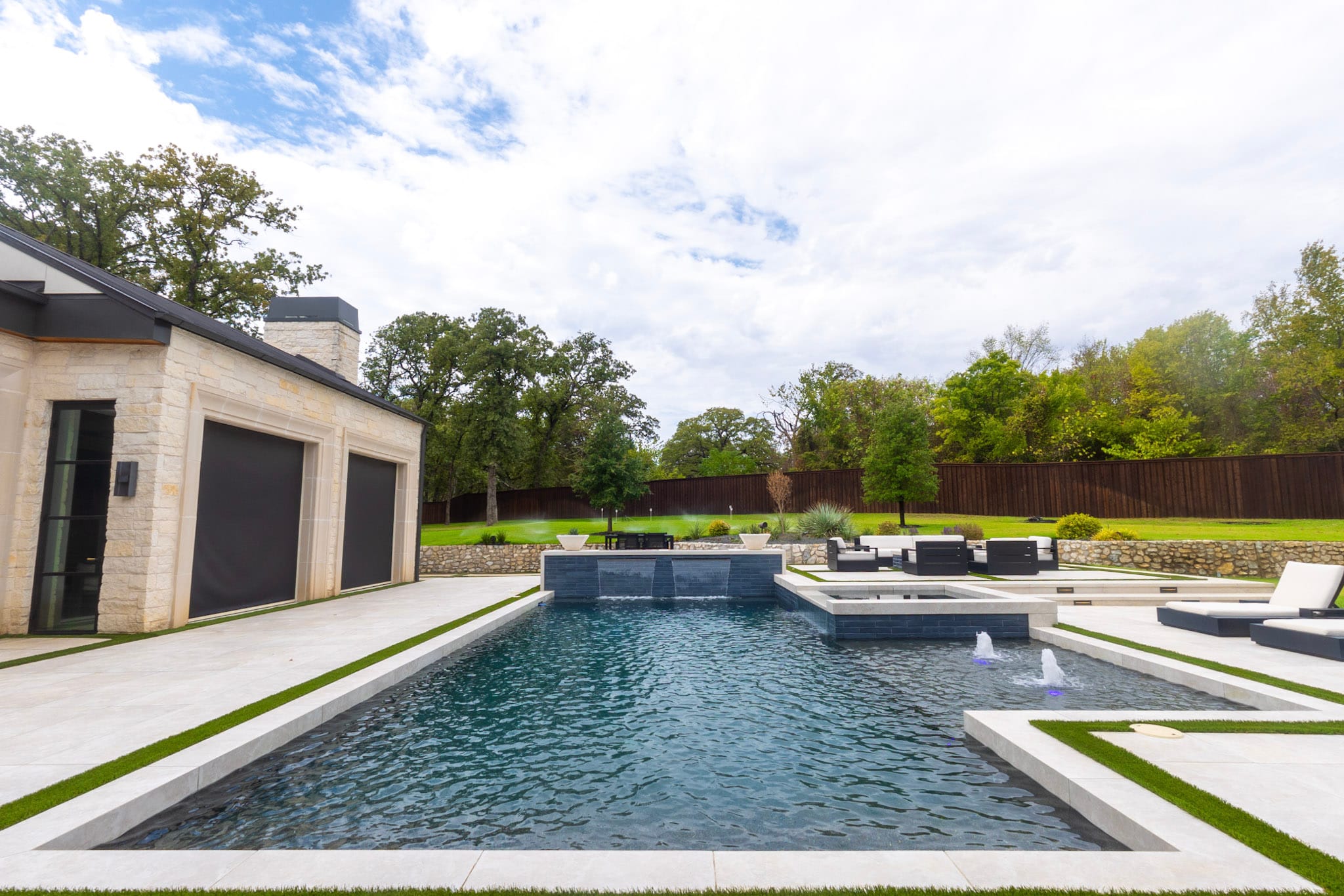 Luxury pool with raised spa and water features in Southlake