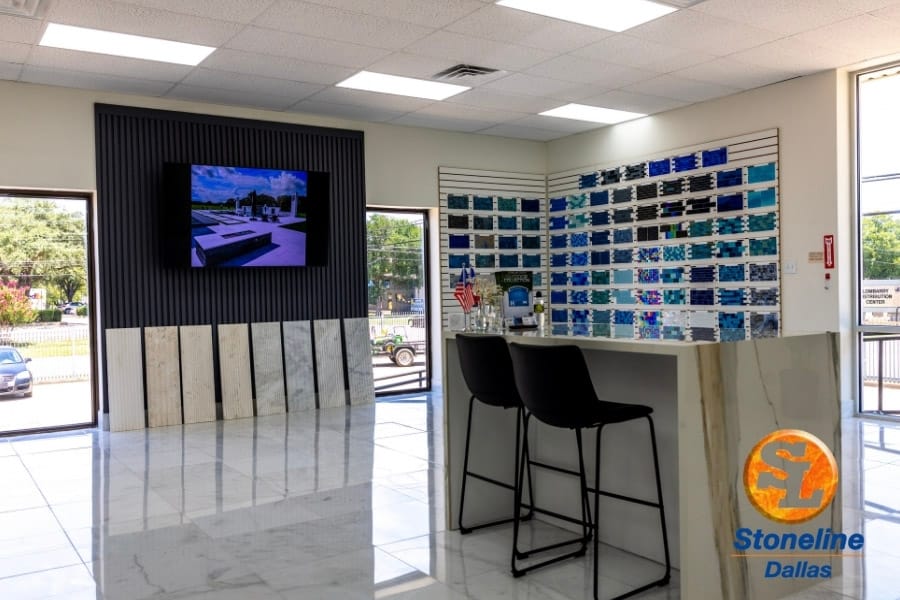 Showroom counter with large-format surface samples behind it