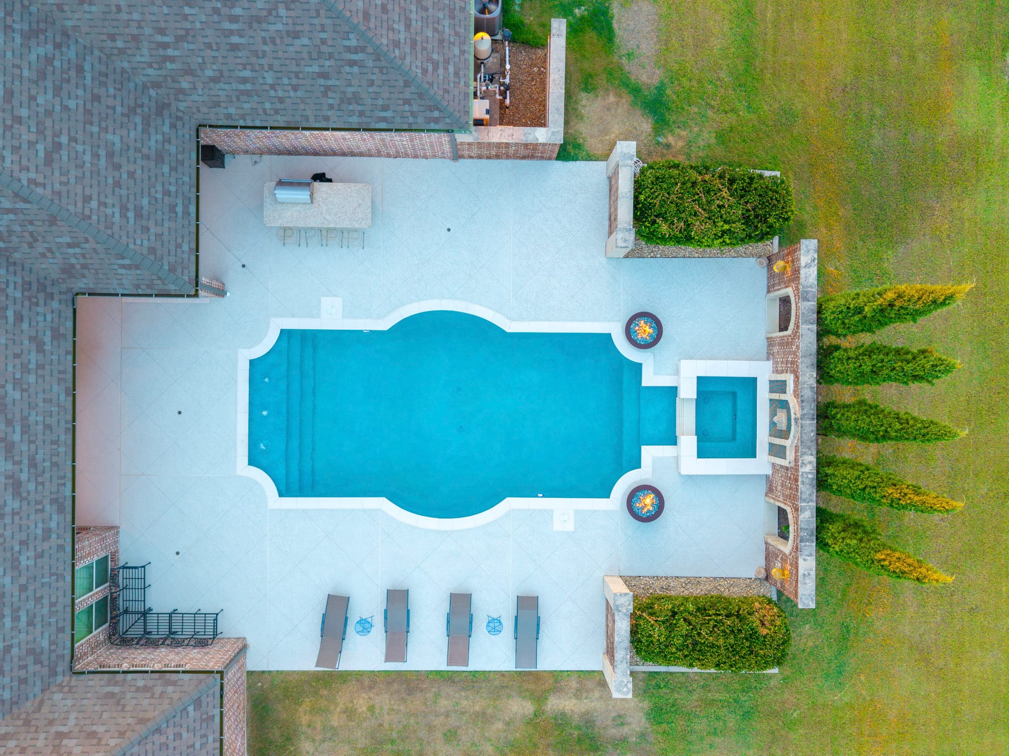 Overhead drone view of remodeled pool spa and fire bowls in Lucas Texas