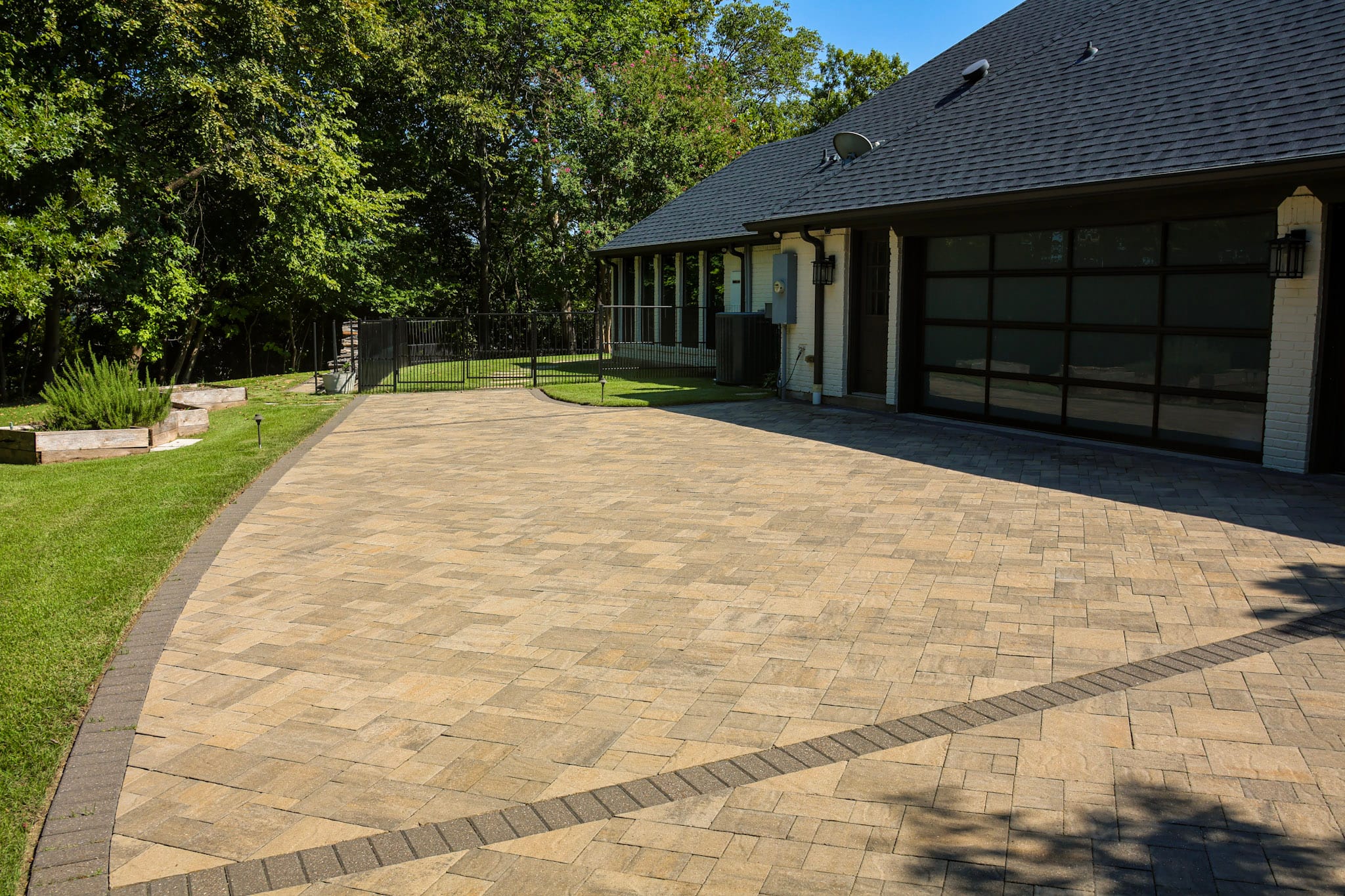 Belgard paver driveway beside a residential garage in Fairview, Texas