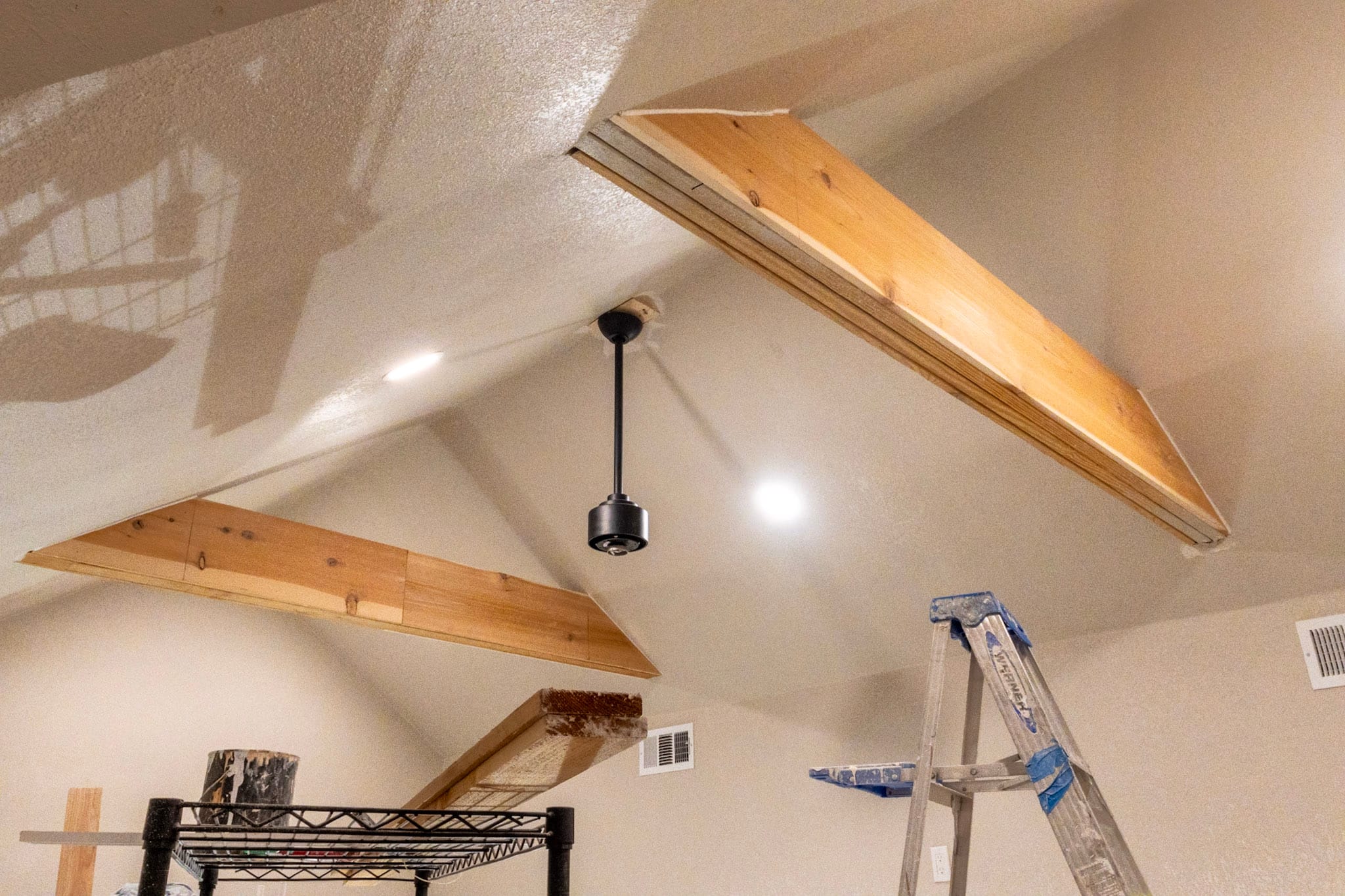 Wood ceiling beams under construction in a The Colony attic addition