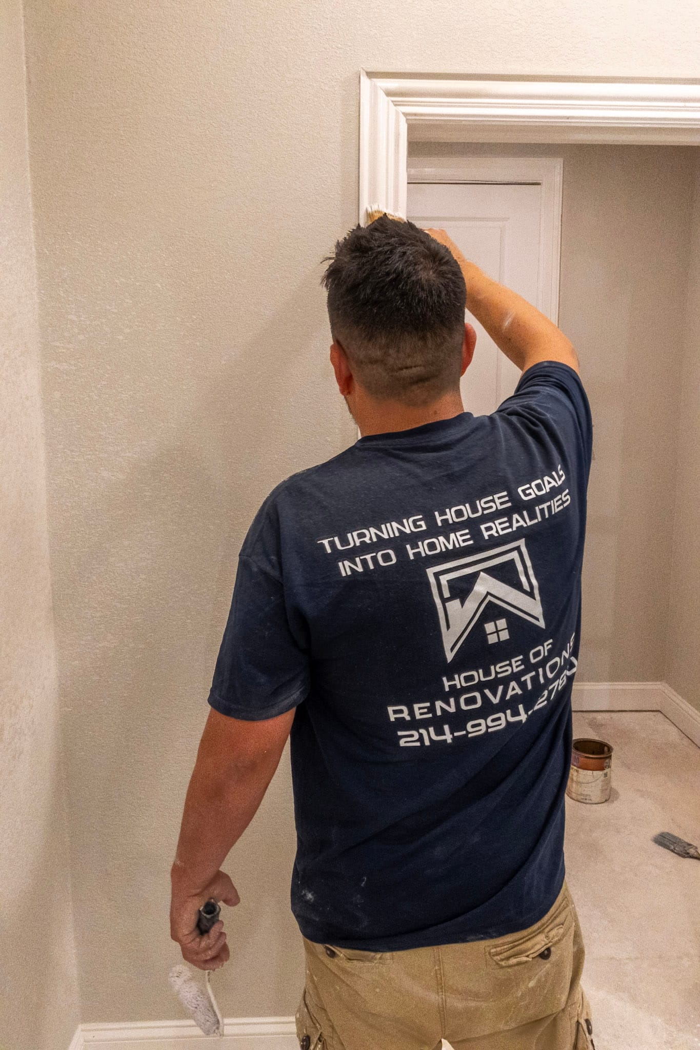 House of Renovations crew member working on a wood ceiling beam during an attic renovation